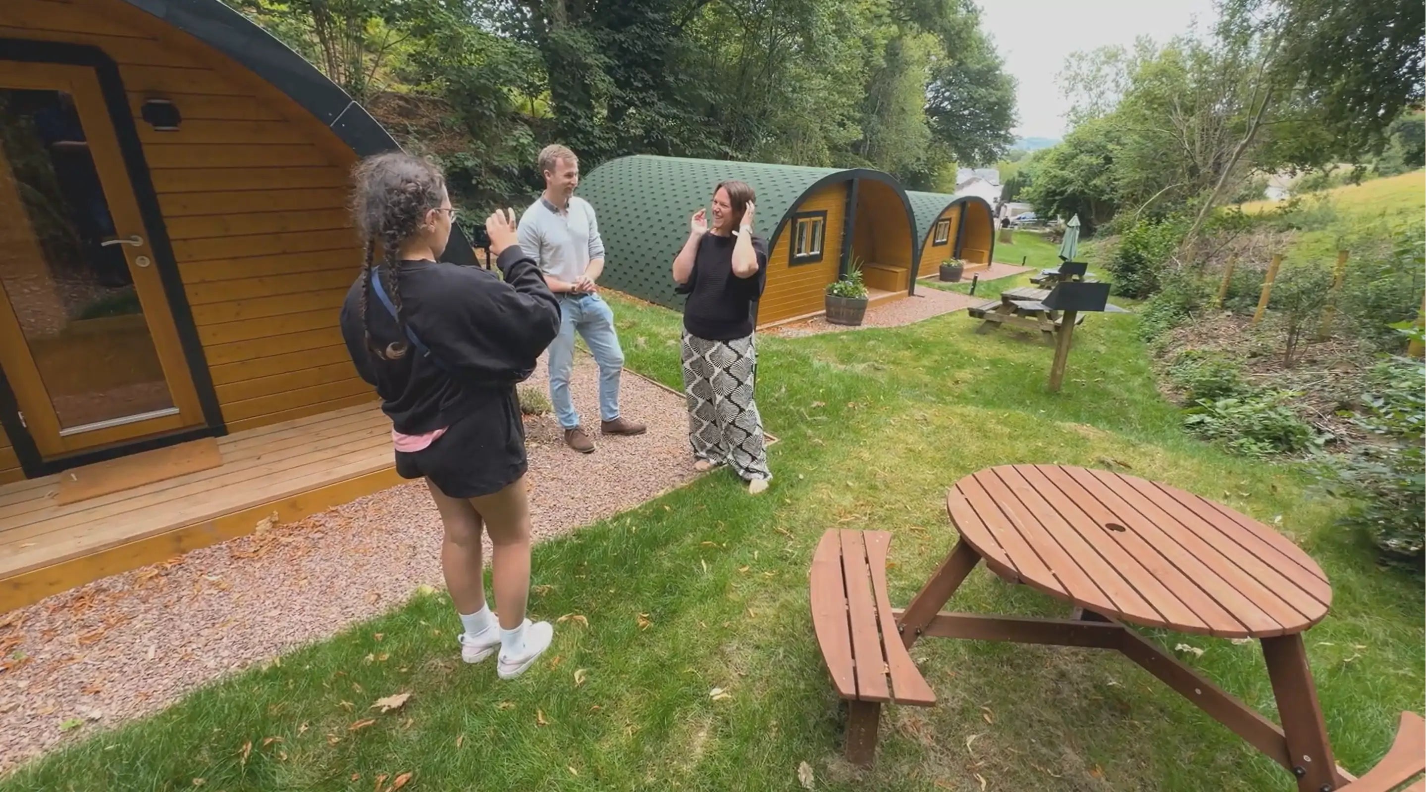 Taylor Glass speaking with Vicki Jones, owner of Tractors and Cream Glamping on-site at The Crown at Pantygelli, capturing the authentic, founder-led spirit behind GlampLaunch.