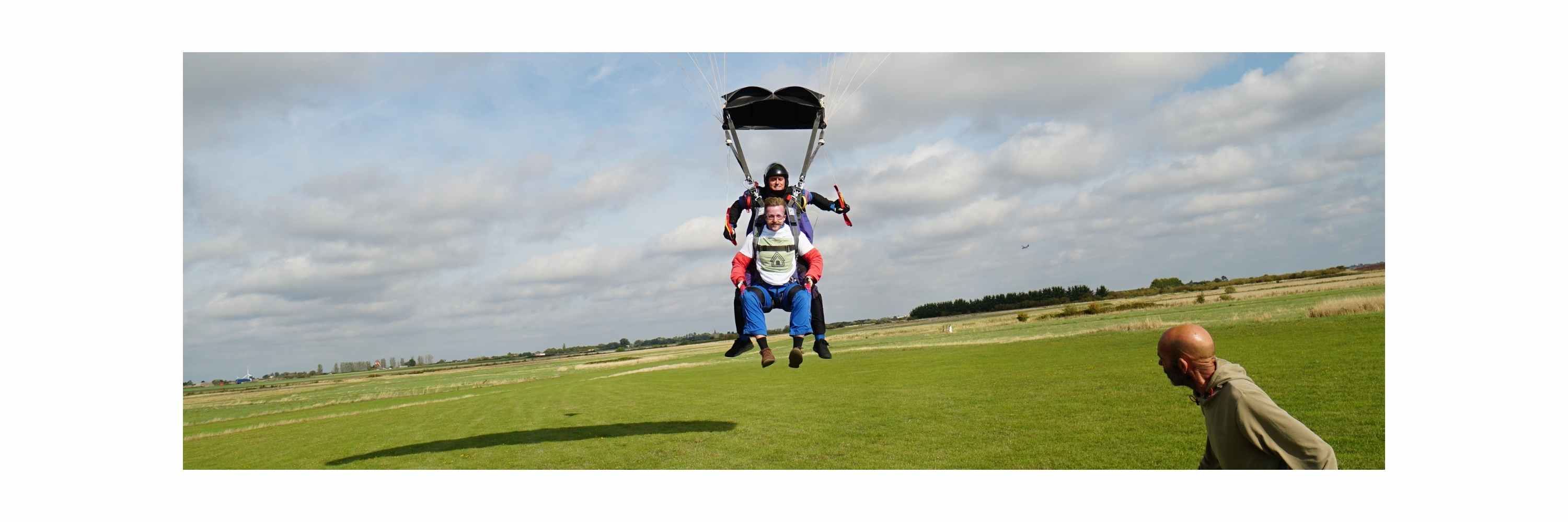 GlampLaunch founder Taylor Glass landing a £500 skydive stunt, proving lean remote-first marketing versus competitors wasting £60k on trade show overheads.