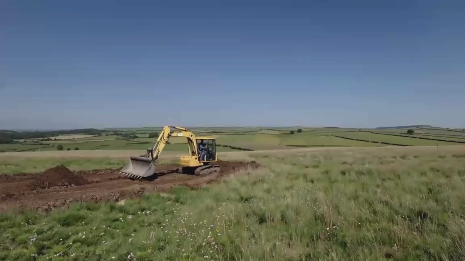 Video showing a timber glamping pod with an arched roof being delivered and installed on-site — featuring groundwork preparation, crane placement, and careful siting in a rural setting — representing the setup and delivery phase of a glamping site with Home Living Luxury.