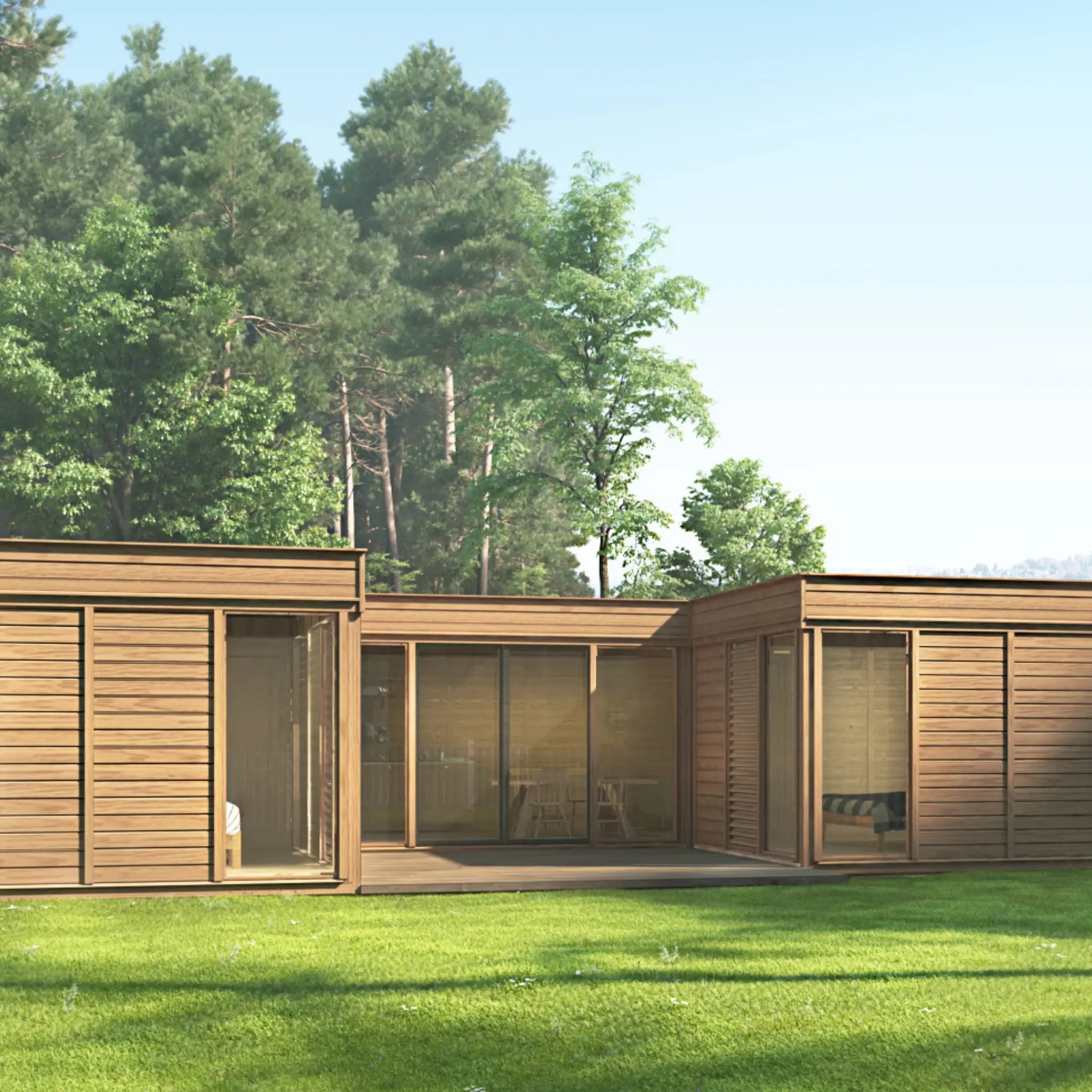 Contemporary modular U-shaped home with wood cladding, large windows, and a forest backdrop, ideal for sustainable off-grid housing projects.
