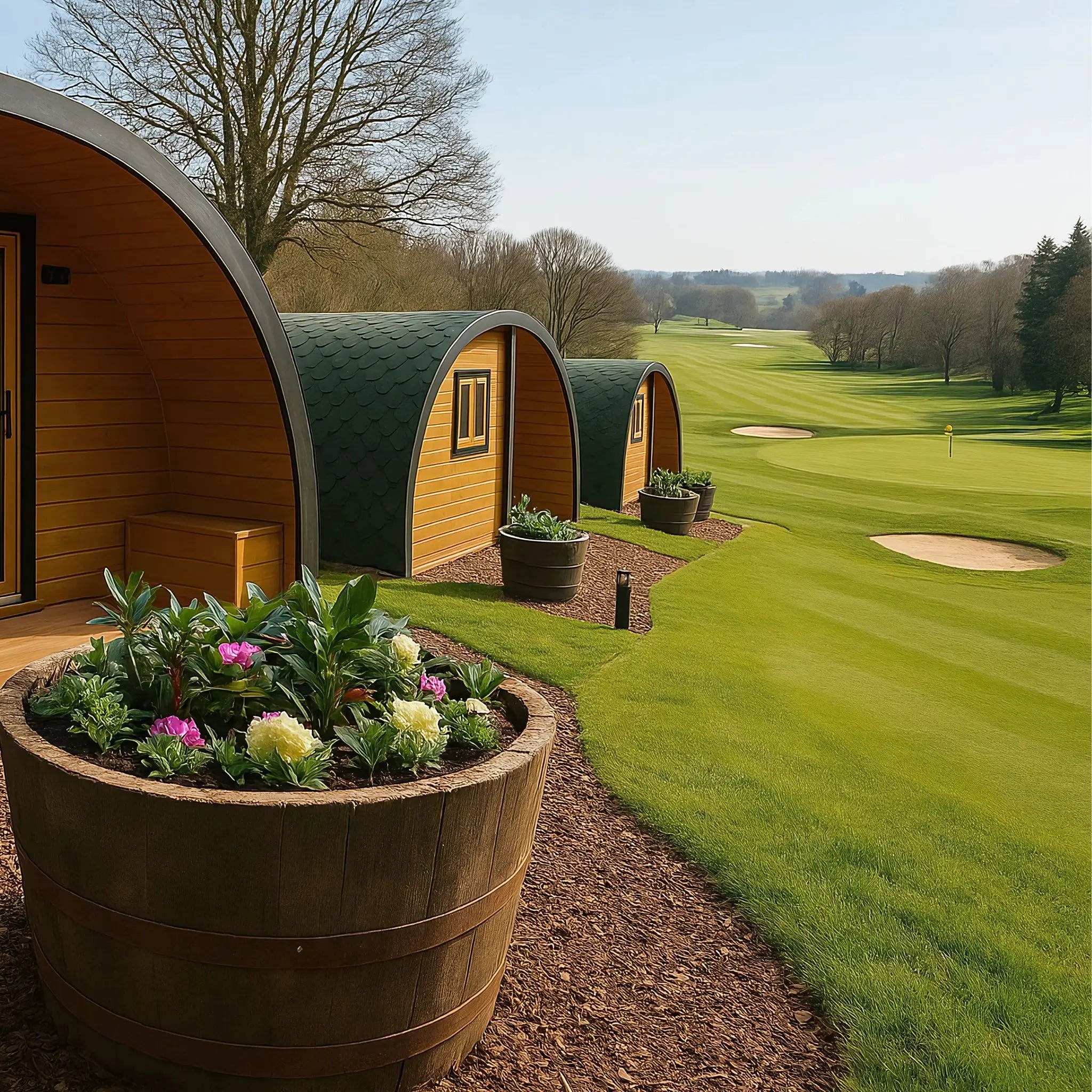 Dual Halfmoon glamping pods at a golf resort with beautiful fairway views, offering stylish and modern golfside accommodation