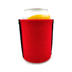 Red wool can cooler wrapped around an aluminium drink can on a white background.