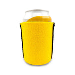 Yellow wool can cooler wrapped around an aluminium drink can on a white background.