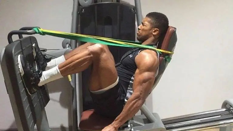 Anthony Joshua training on a leg press machine supplied by GlampLaunch in early 2024, ahead of his fight with Francis Ngannou.
