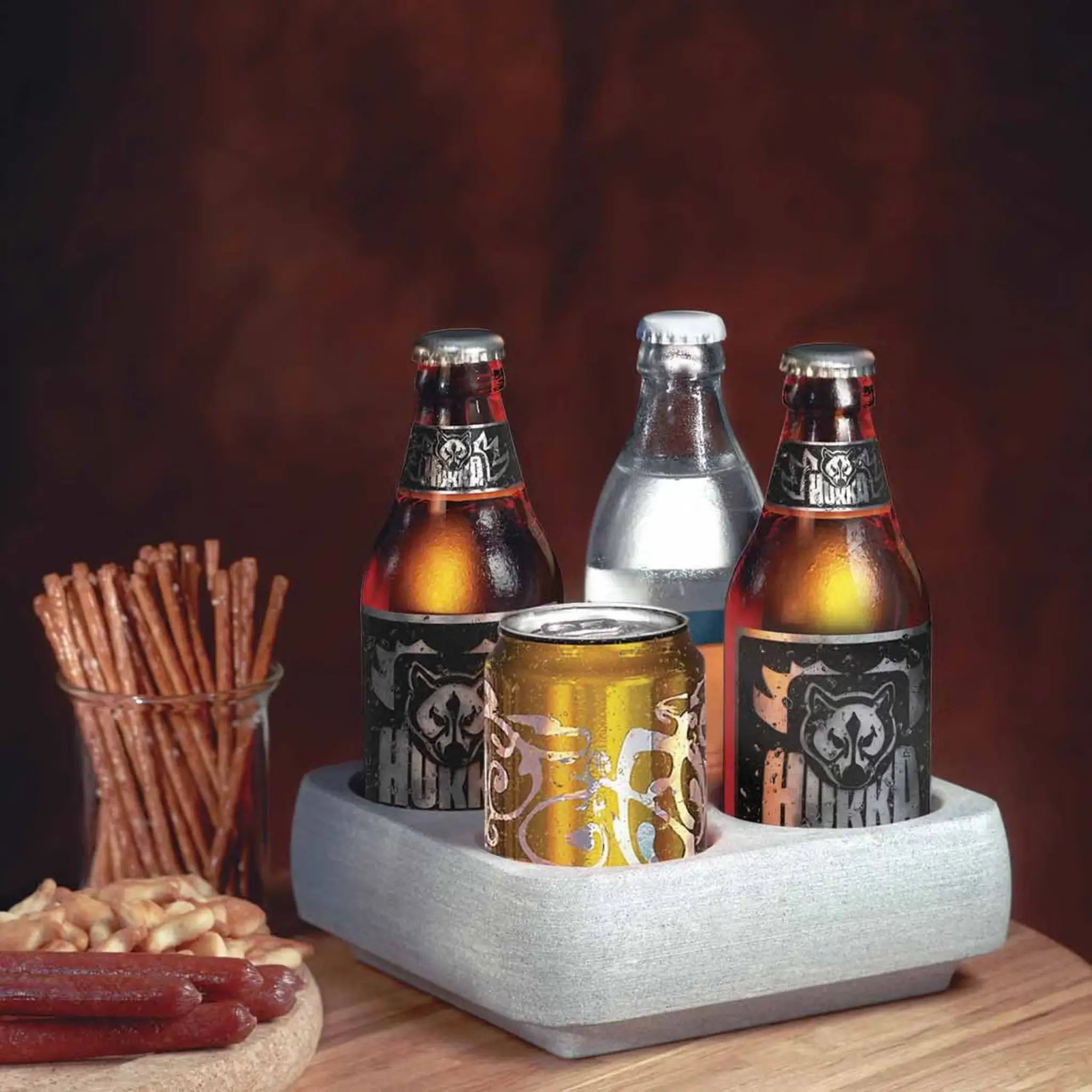 Hukka Huurteinen soapstone drink cooler holding glass bottles and cans on a table