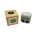 Hukka Sauna Text Steam Stone with product box on a white background.