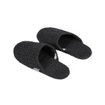 Black Luhta Home Pellava slippers with textured waffle fabric on a white background.