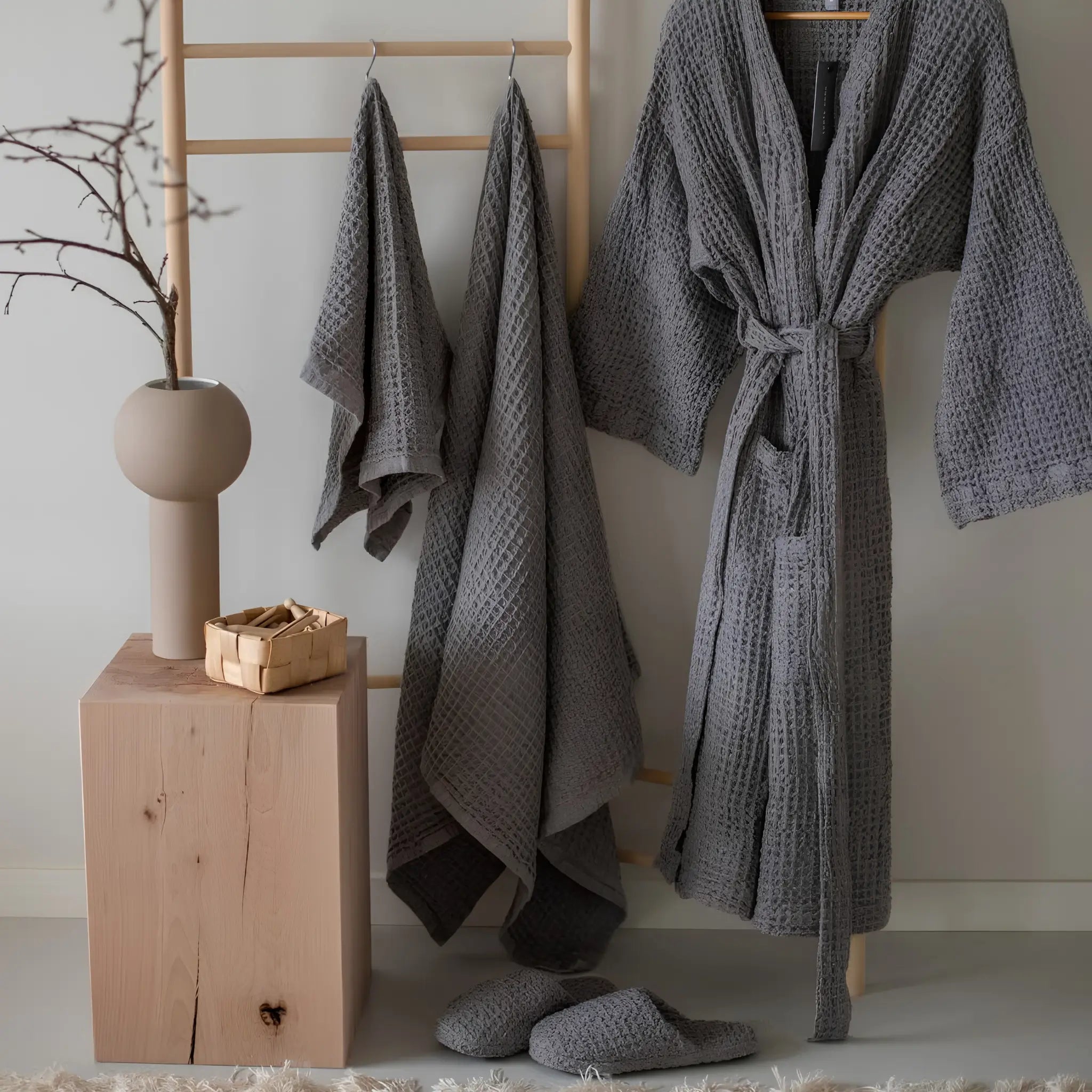 Rento Kenno bathrobes hanging in a calm bathroom setting with natural décor.
