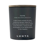 Luhta Home Tupa scented candle with smoke, dry wood, pine oil and tar fragrance on a white background.