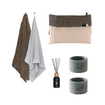 Premium couples sauna comfort set with bath towels, sauna pillows, reed diffuser and two soapstone drink holders on a white background