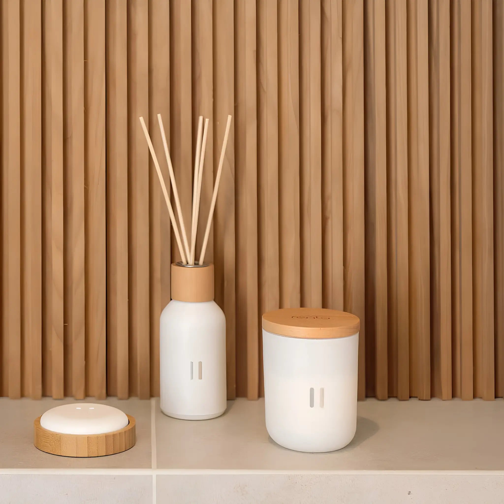 Scandinavian-style birch reed diffuser and candle creating a calming home atmosphere