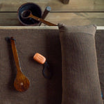 Dark brown Rento Kenno sauna pillow with matching seat cover inside a traditional sauna