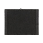 Black Rento Kenno sauna pillow with matching black seat cover inside a wooden sauna room