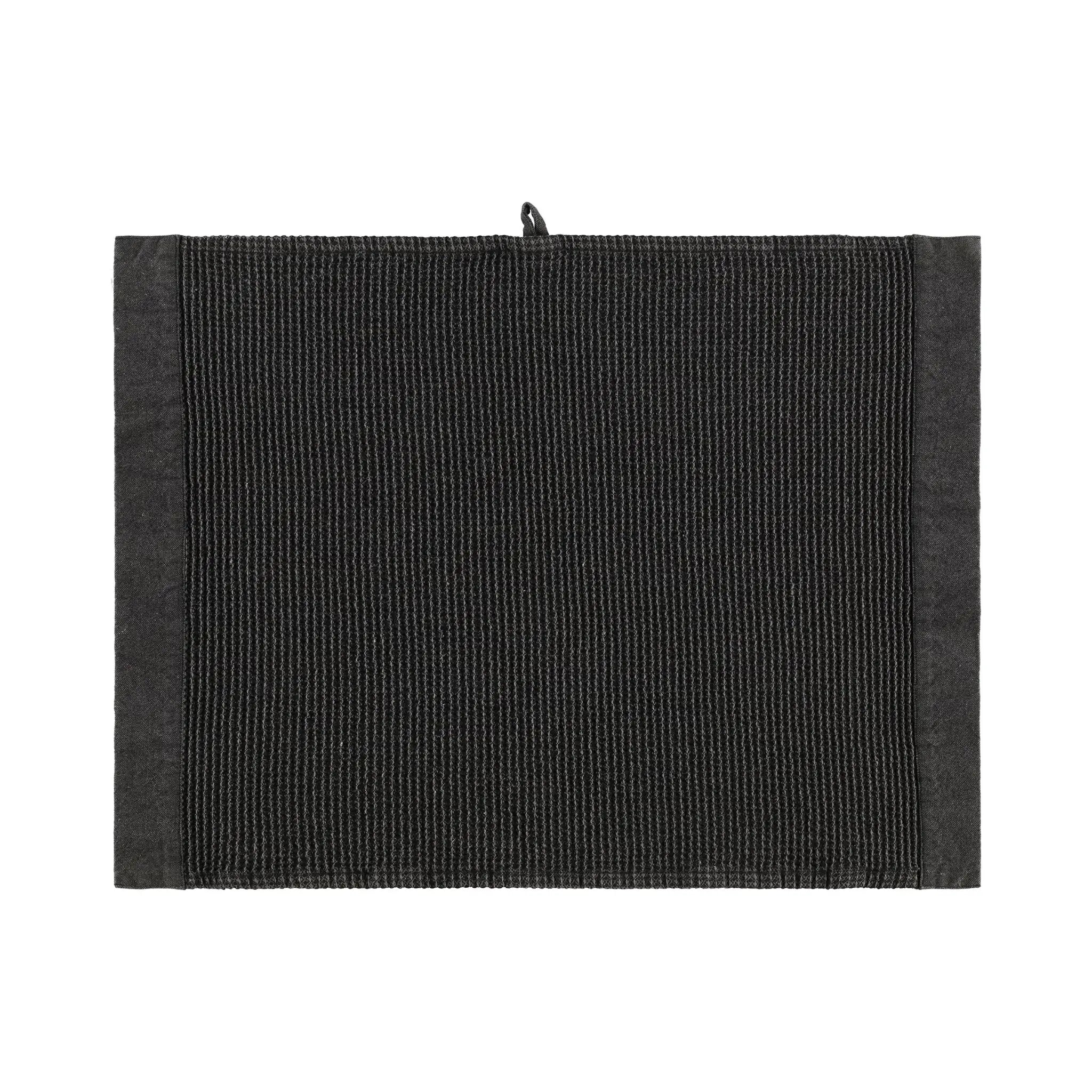 Black Rento Kenno sauna pillow with matching black seat cover inside a wooden sauna room