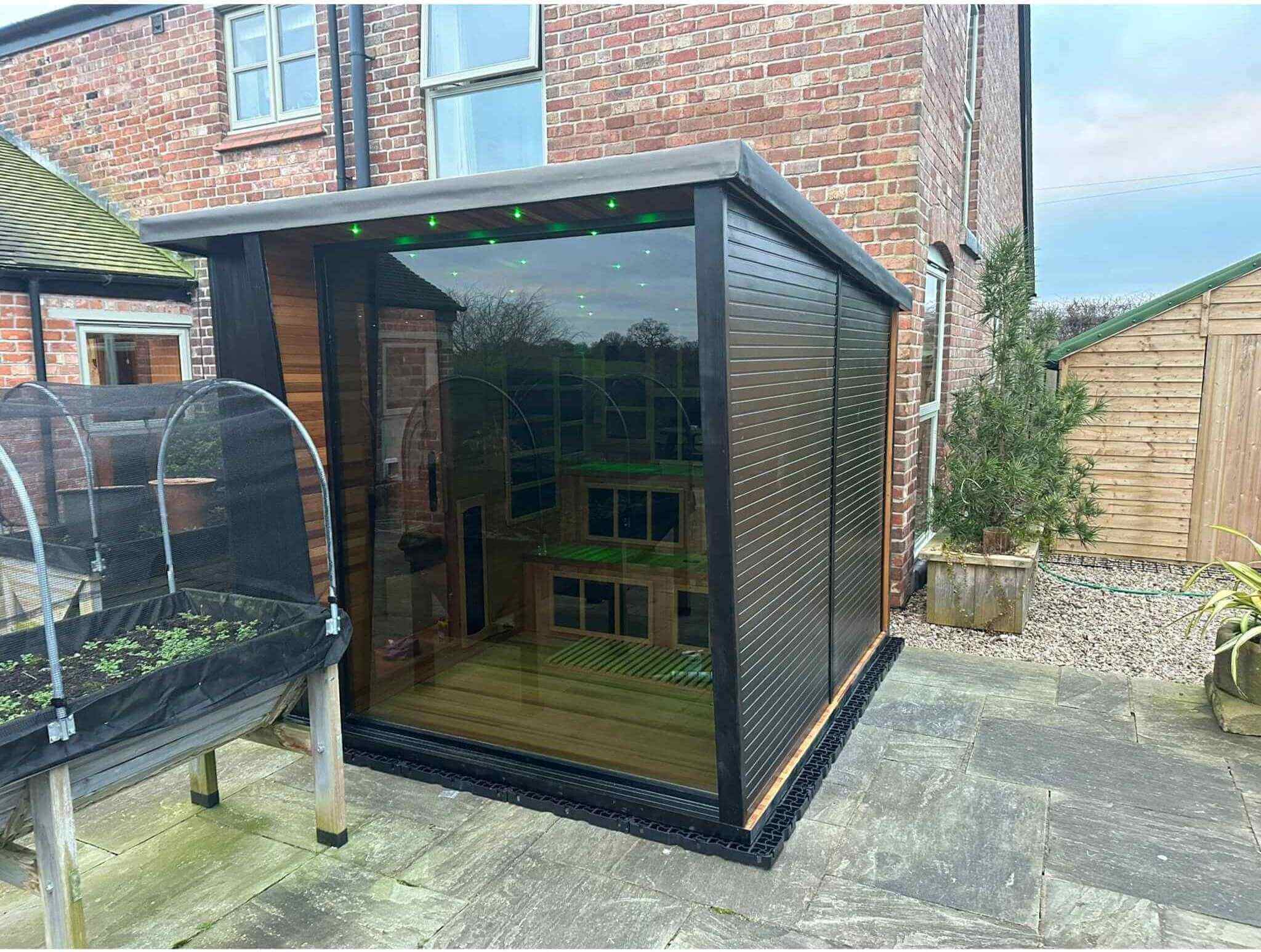 Outdoor sauna pod at a client’s home alongside garden furniture, representing GlampLaunch’s early product sales boom in 2024.