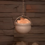 Saunia soapstone salt bowl hanging with Himalayan salt stones in a sauna