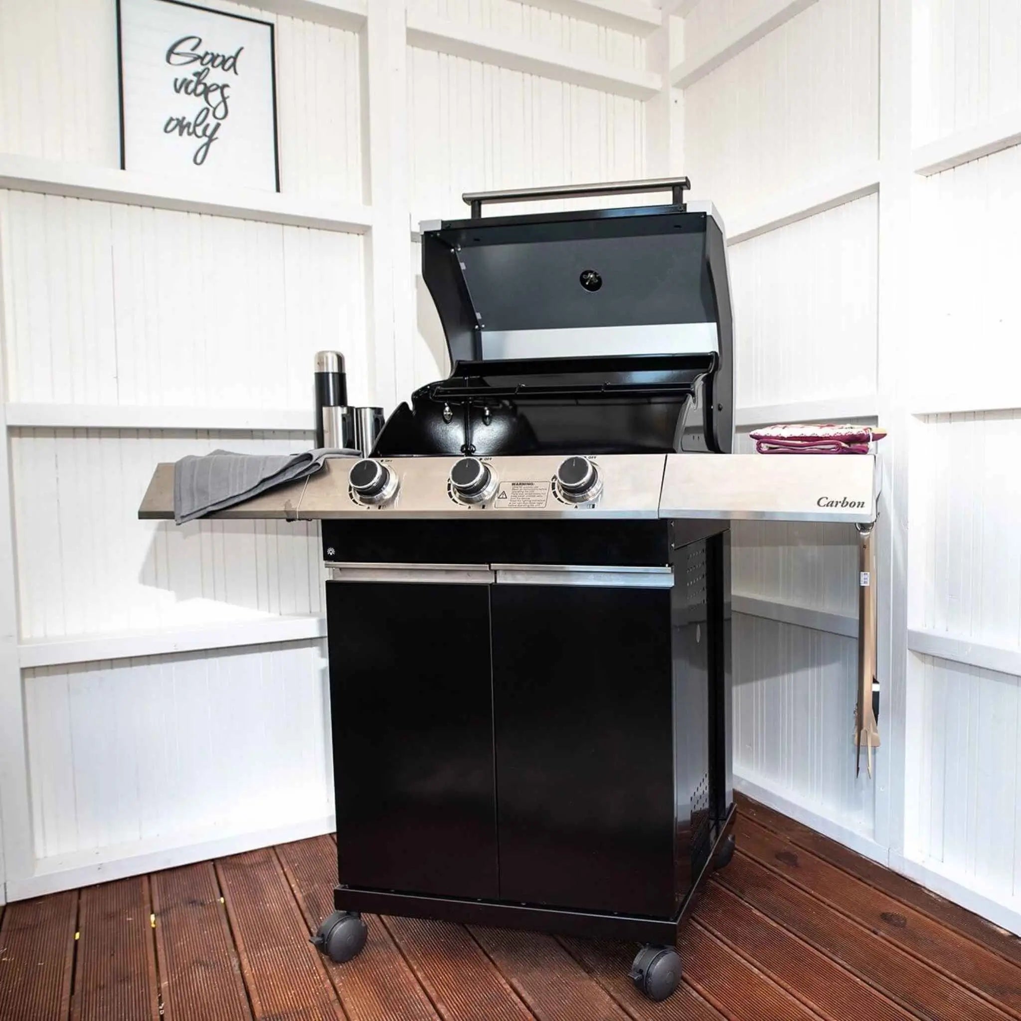 Interior Grill Setup with Seating in a Stylish Garden Room