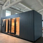 The Large GlampTainer container-style glamping unit – detailed view of right side exterior with sleek cladding and large glass-panel doors
