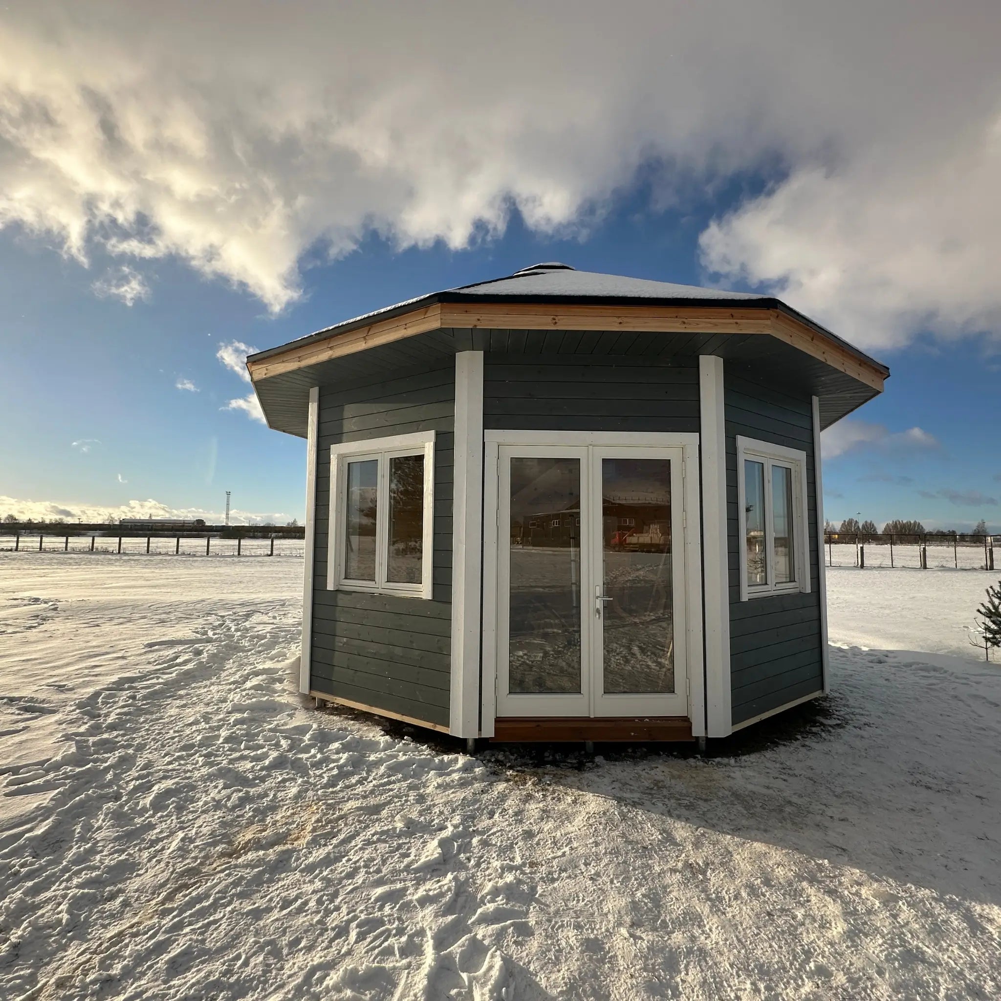 Front exterior view of the Altura Loft Cabin in snow highlighting the loft cabin design