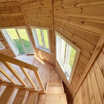 Close-up of loft ceiling and window arrangement inside the Altura Loft Cabin showing decagon roof structure