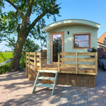 Archwood 4 person shepherd’s hut exterior with wooden deck and countryside views