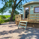 Front entrance of the Archwood 4 person shepherd’s hut with raised timber decking