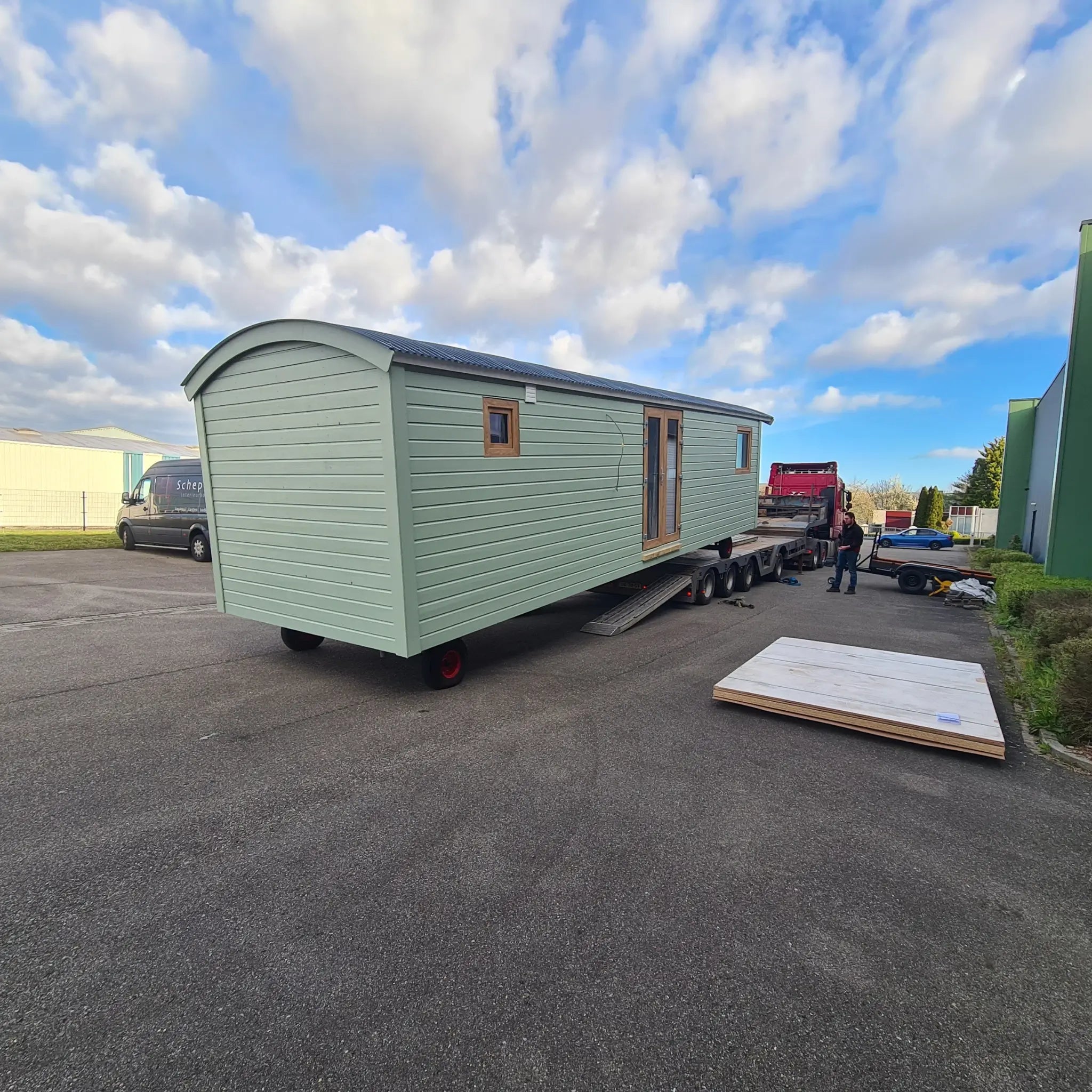 Rear exterior view of the Archwood shepherd’s hut with curved roof