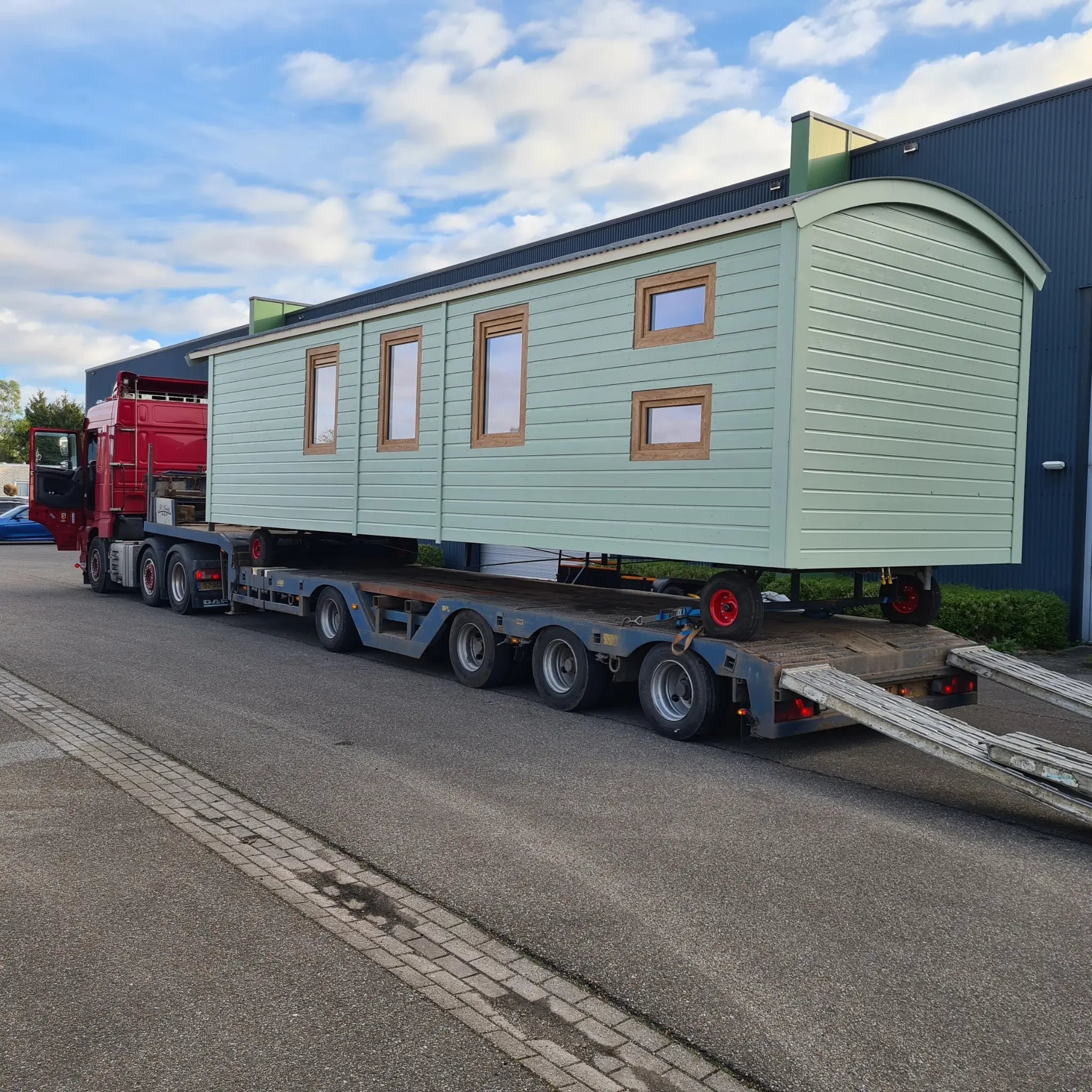 Shepherd’s hut loaded onto trailer for delivery to glamping site