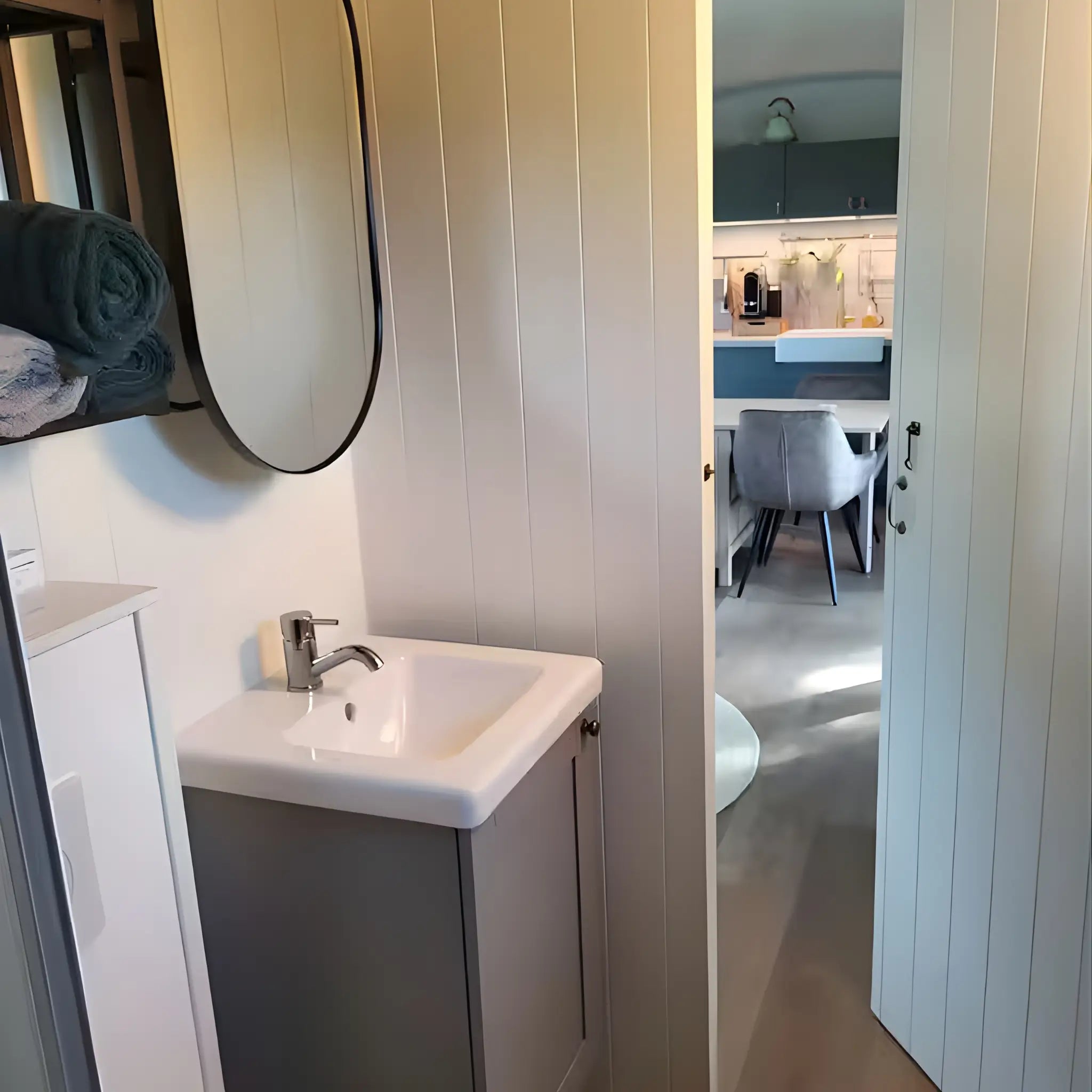 Bathroom sink and mirror inside the Archwood shepherd’s hut