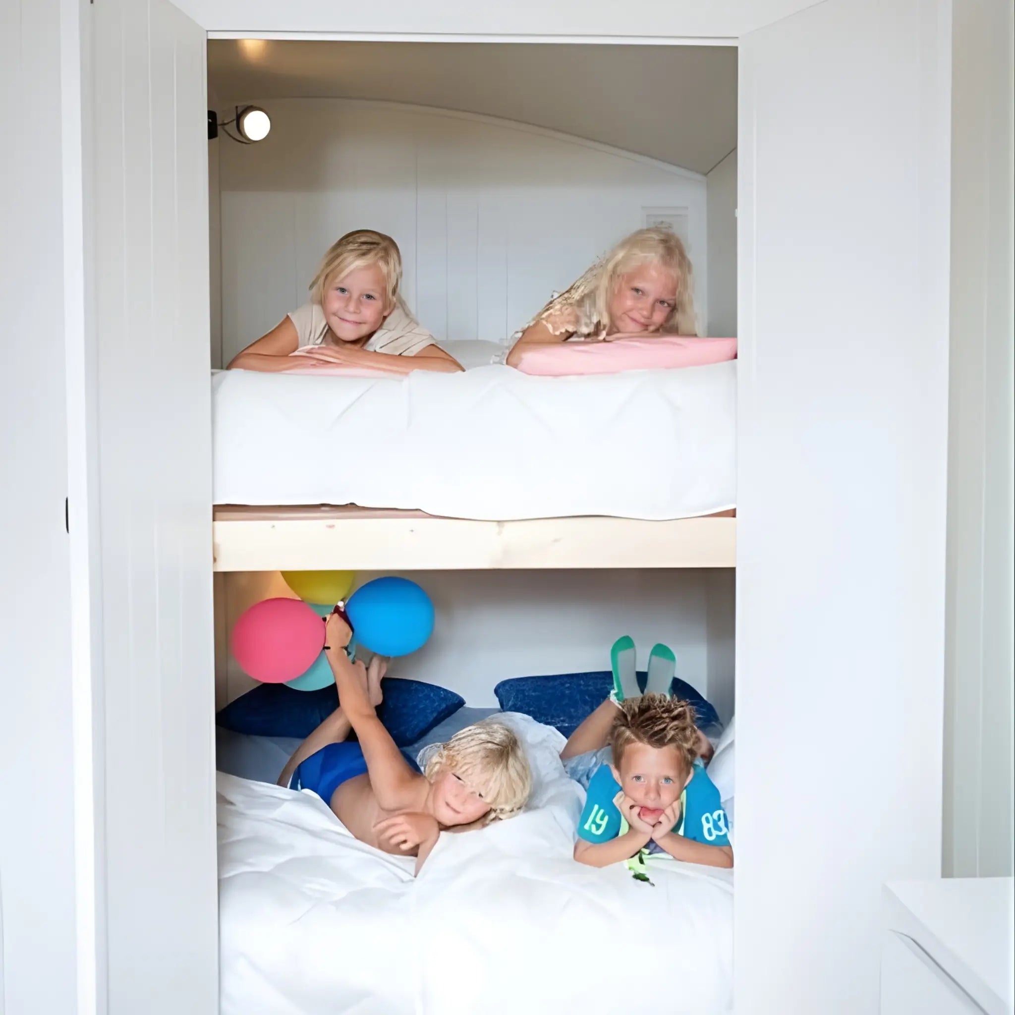 Children enjoying bunk bed sleeping area inside the Archwood shepherd’s hut