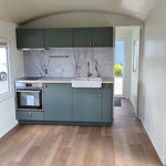 Modern kitchenette inside Archwood glamping shepherd’s hut