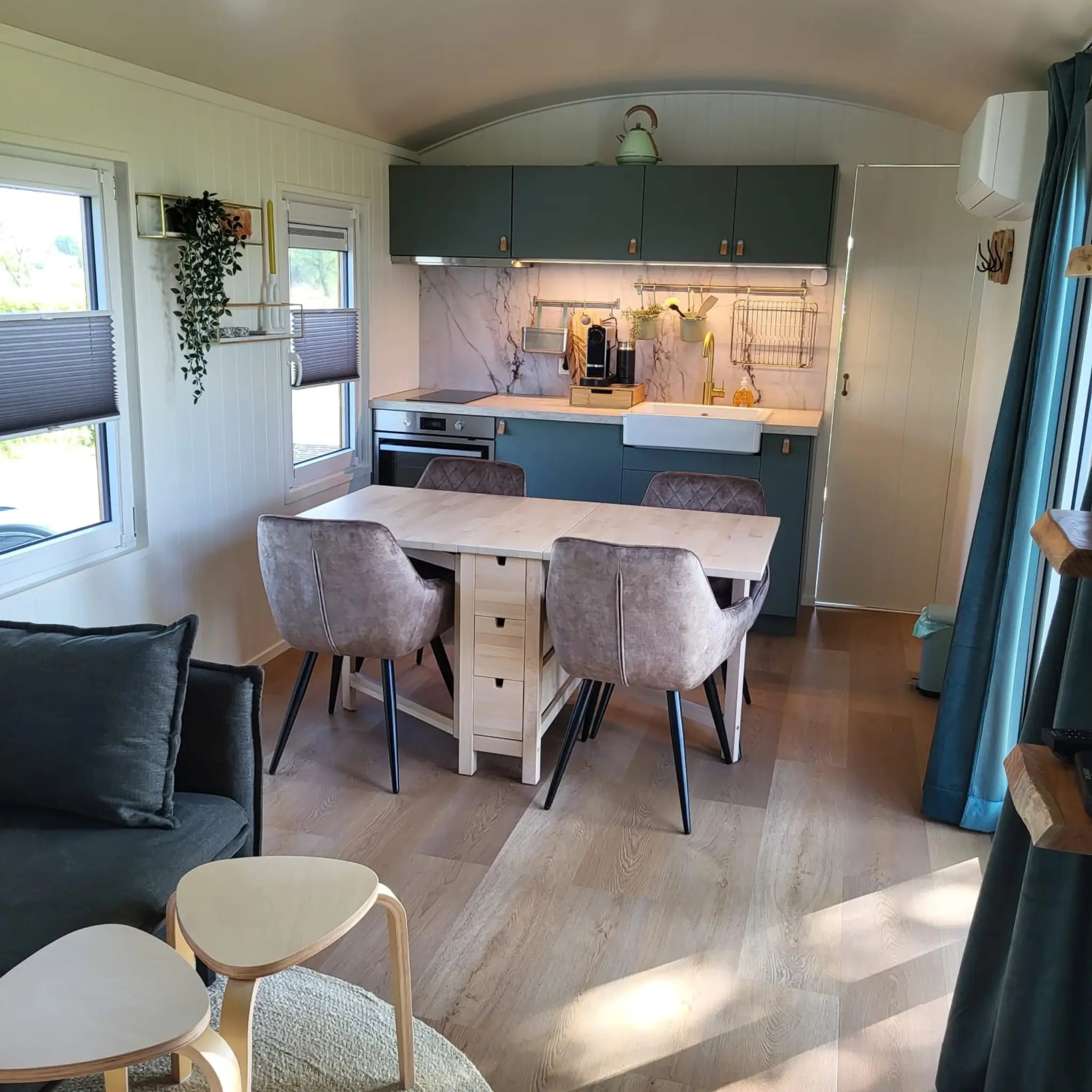 Open plan living and kitchen area inside the Archwood 4 person shepherd’s hut