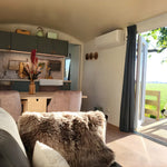 Open plan living and dining area with kitchen inside the Archwood 4 person shepherd’s hut