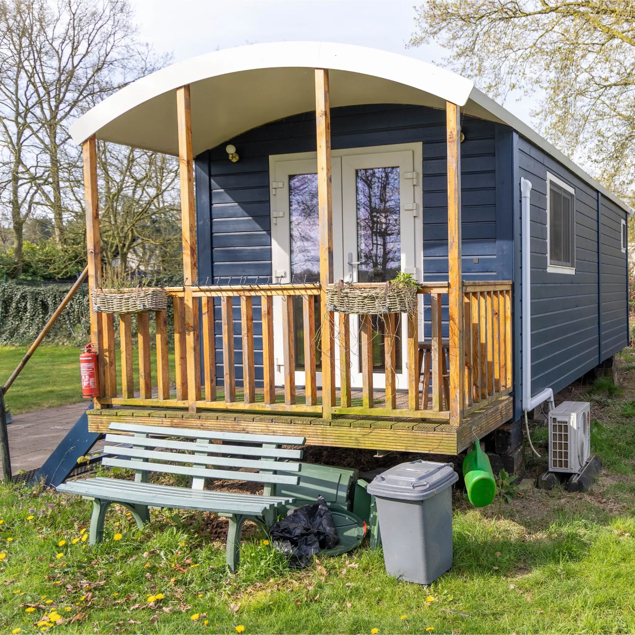 Front exterior view of a luxury shepherd’s hut with countryside views