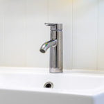 Modern bathroom sink and chrome tap inside a luxury 2 person shepherd’s hut
