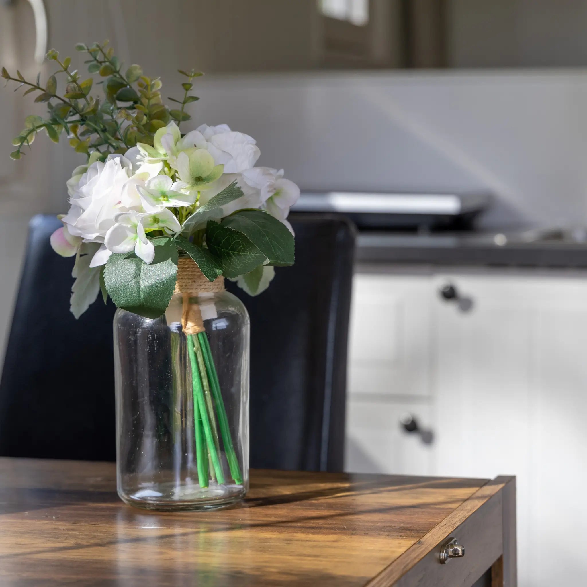 Decorative dining table styling inside a luxury glamping shepherd’s hut