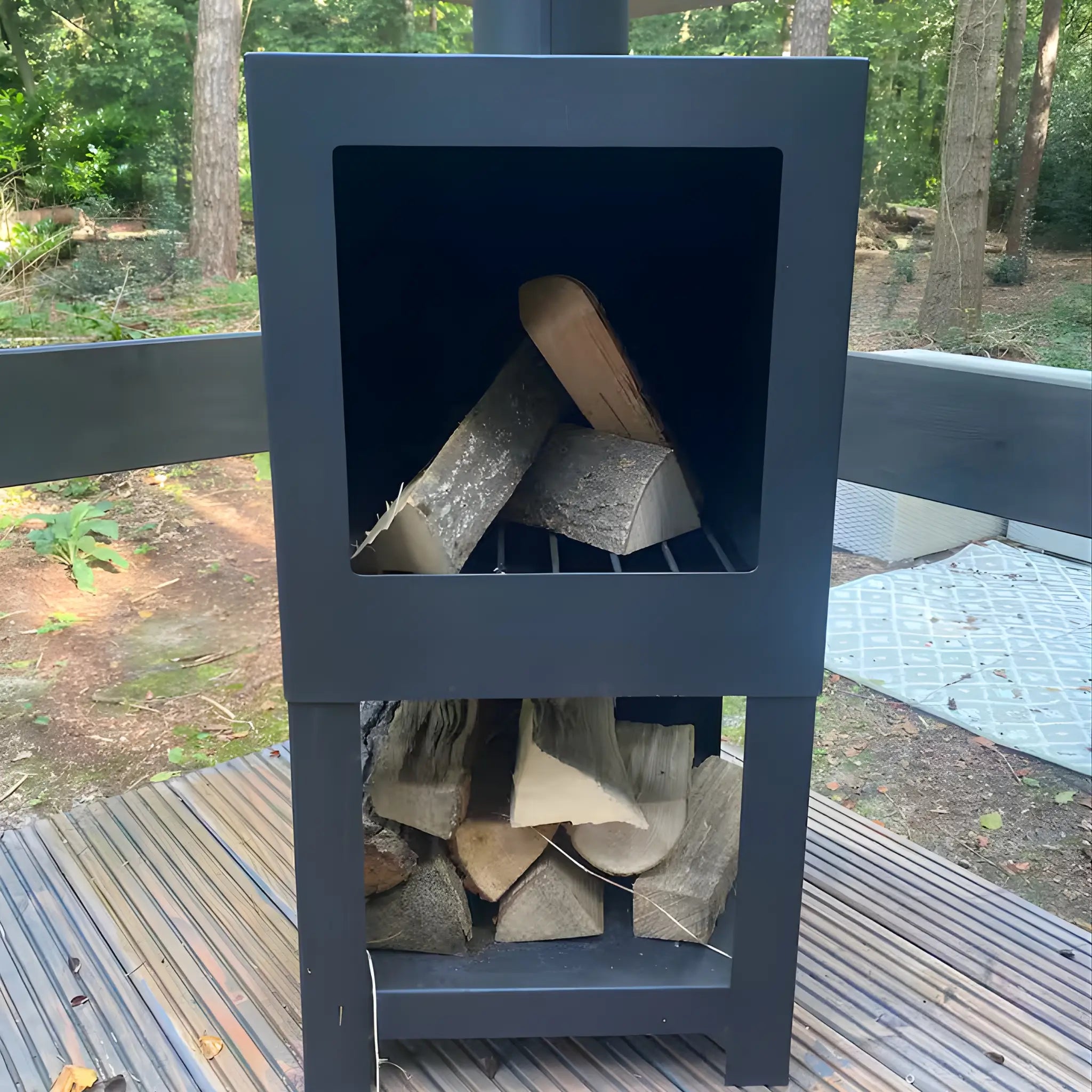 Outdoor wood burning stove on the deck of Bowridge glamping shepherd’s hut
