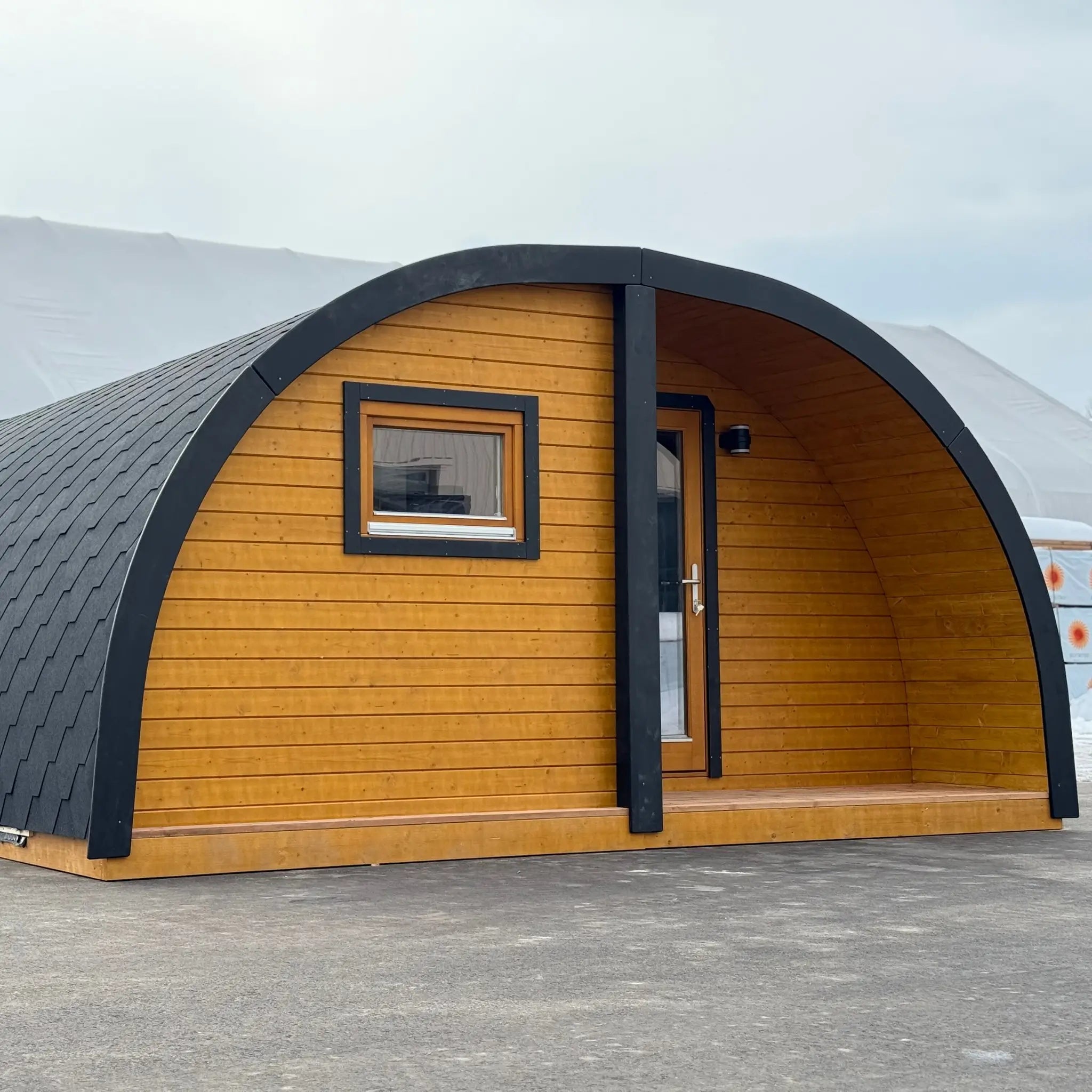 Front View of Dual Halfmoon Pod Exterior Entrance and Timber Cladding