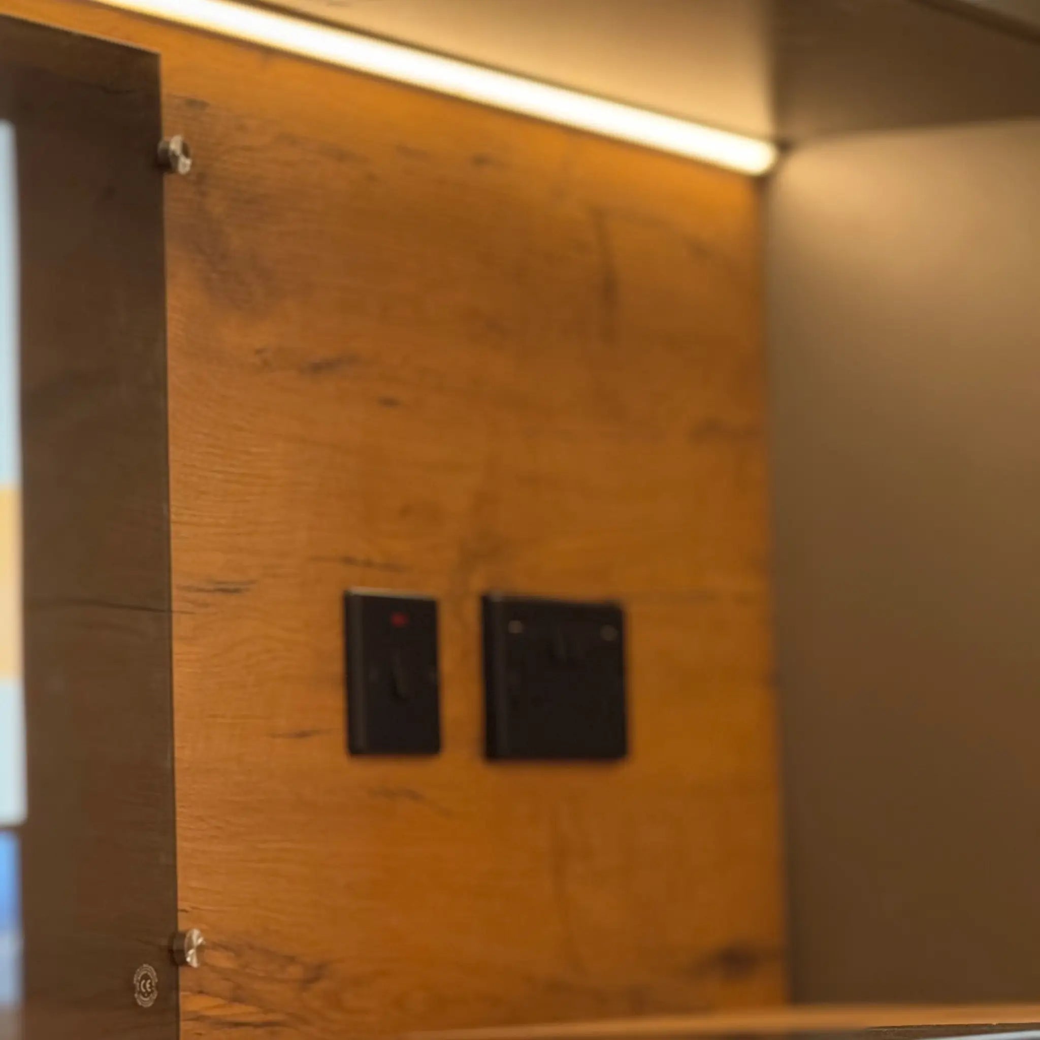 Electrical Outlet and Kitchen Splashback Detail in Pod Interior