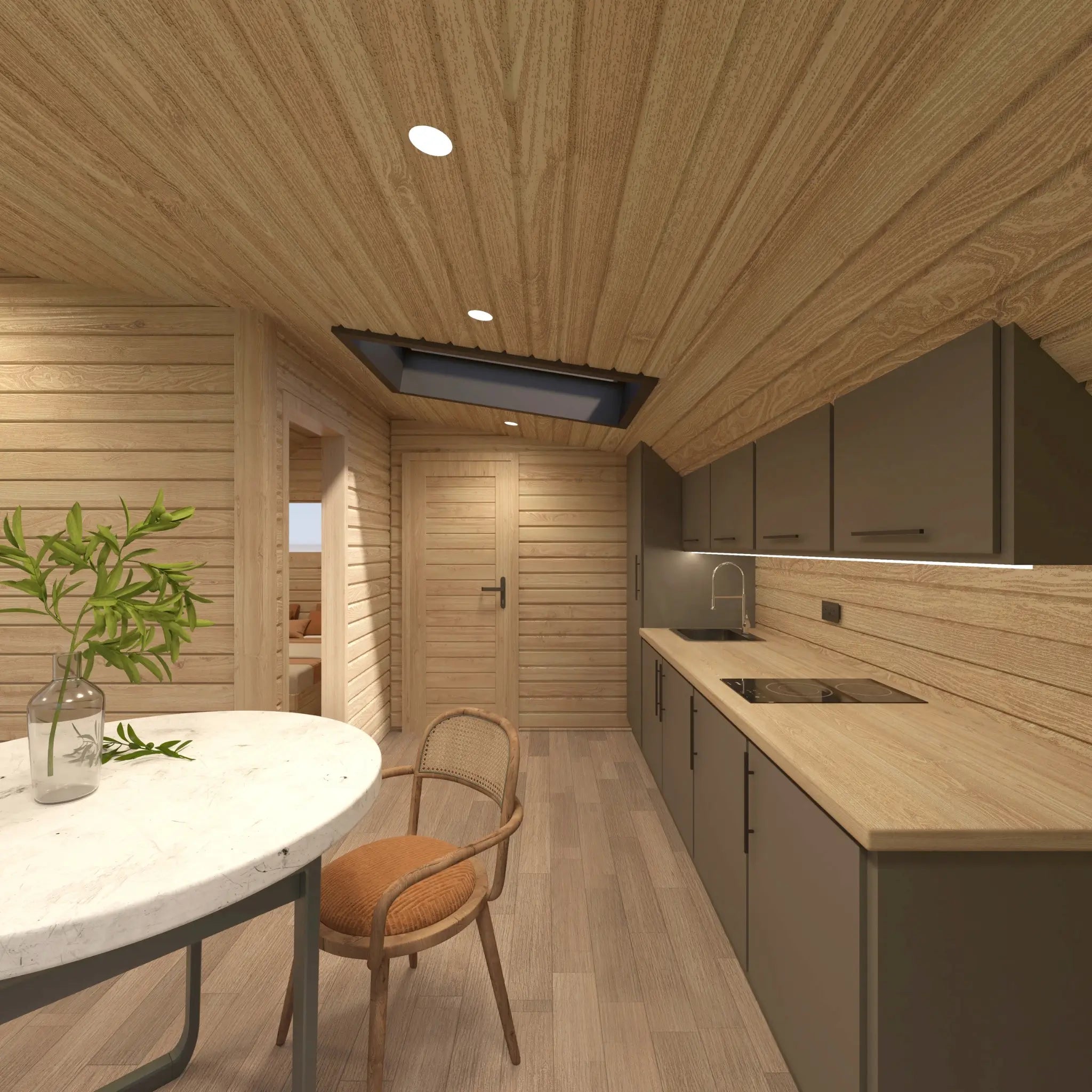 Contemporary kitchen inside The Eagle's Nest luxury 2 person glamping pod with integrated appliances, skylight and dining area