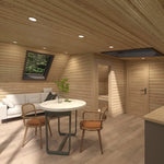 Open-plan living and dining area inside The Eagle's Nest luxury 2 person glamping pod with skylight and timber interior