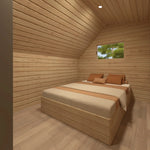 Double bedroom inside The Eagle's Nest luxury 2 person glamping pod with timber-lined walls and built-in bed