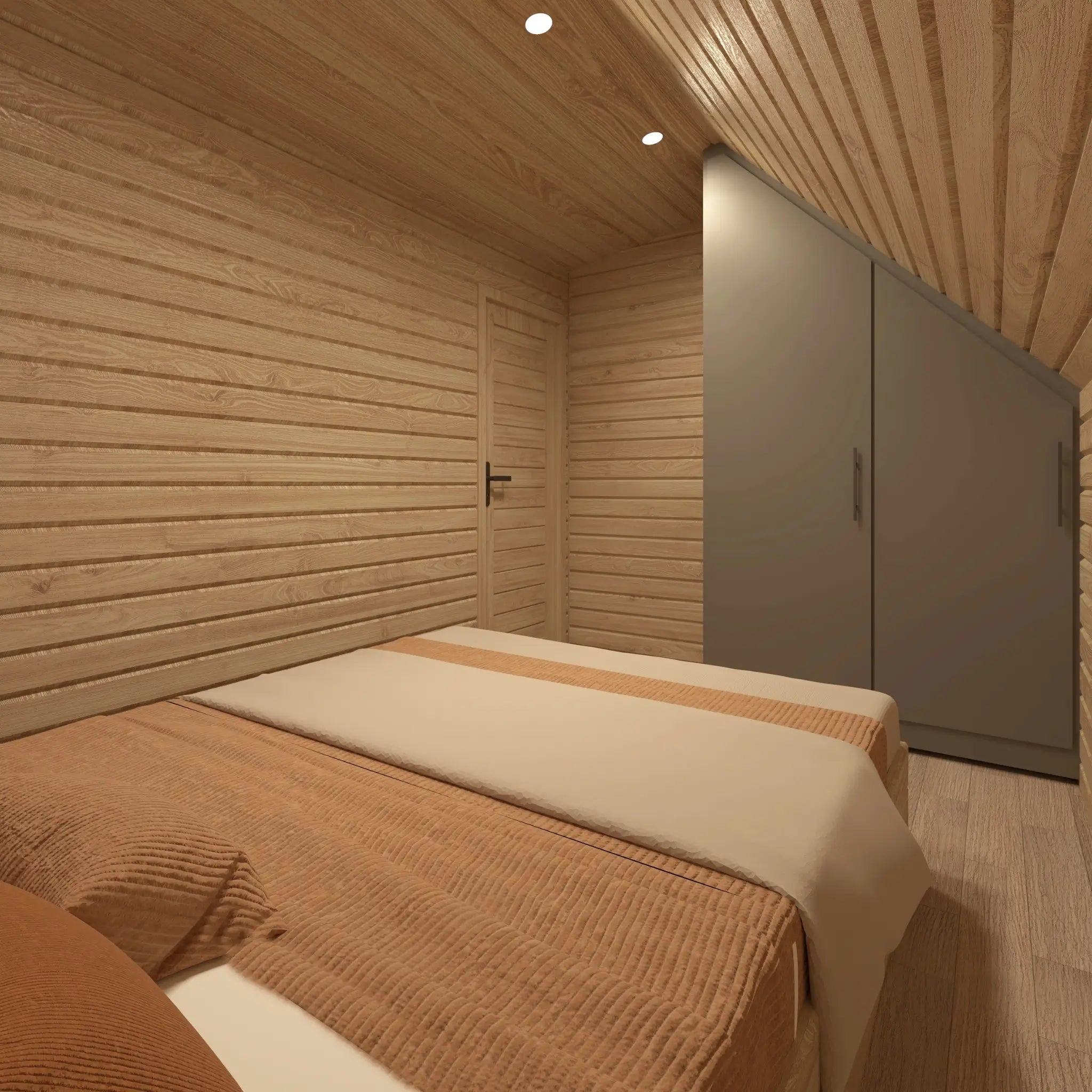 Bedroom interior of The Eagle's Nest luxury 2 person glamping pod featuring fitted wardrobe and warm timber finishes
