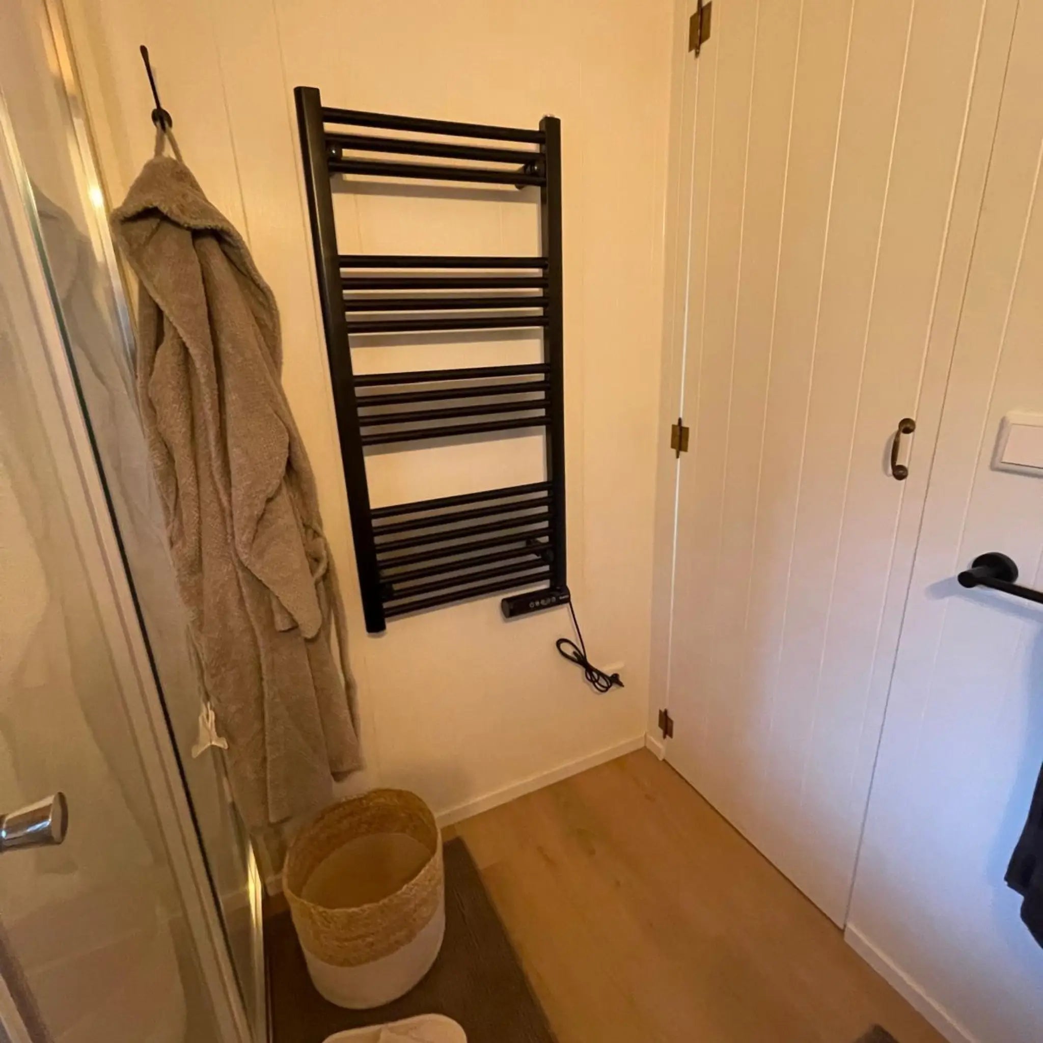 Bathroom towel rail and storage cupboard inside The Elmstead 2 Person Shepherd’s Hut