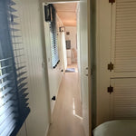 Interior hallway of The Elmstead 2 Person Shepherd’s Hut connecting the bedroom to the open-plan living area
