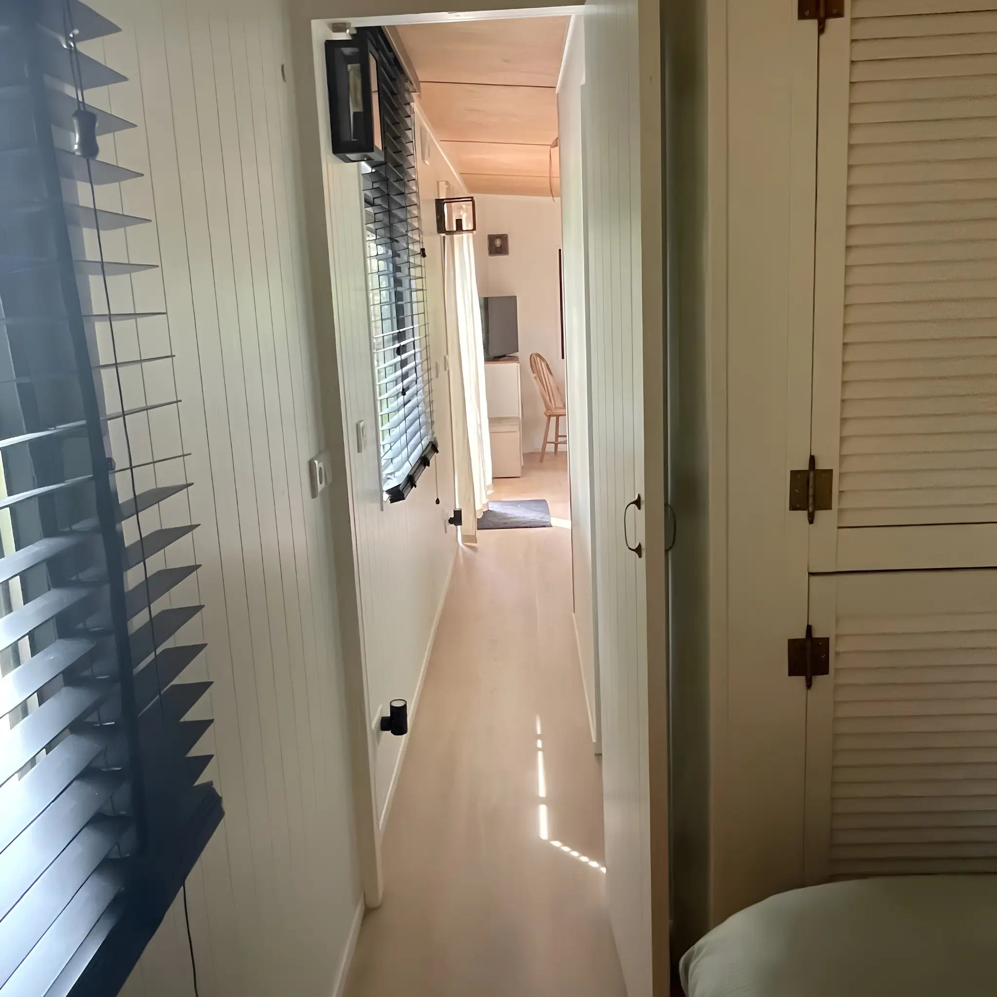 Interior hallway of The Elmstead 2 Person Shepherd’s Hut connecting the bedroom to the open-plan living area
