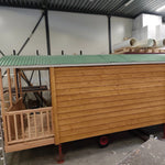 Side exterior view of The “Fernwood” Art Studio during construction with timber cladding and curved roof