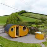 Grotto 3 person glamping pod with wood-fired hot tub and rural landscape setting