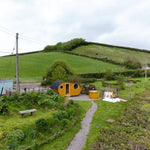 Grotto glamping pod installed on site with hot tub and landscaped garden surroundings