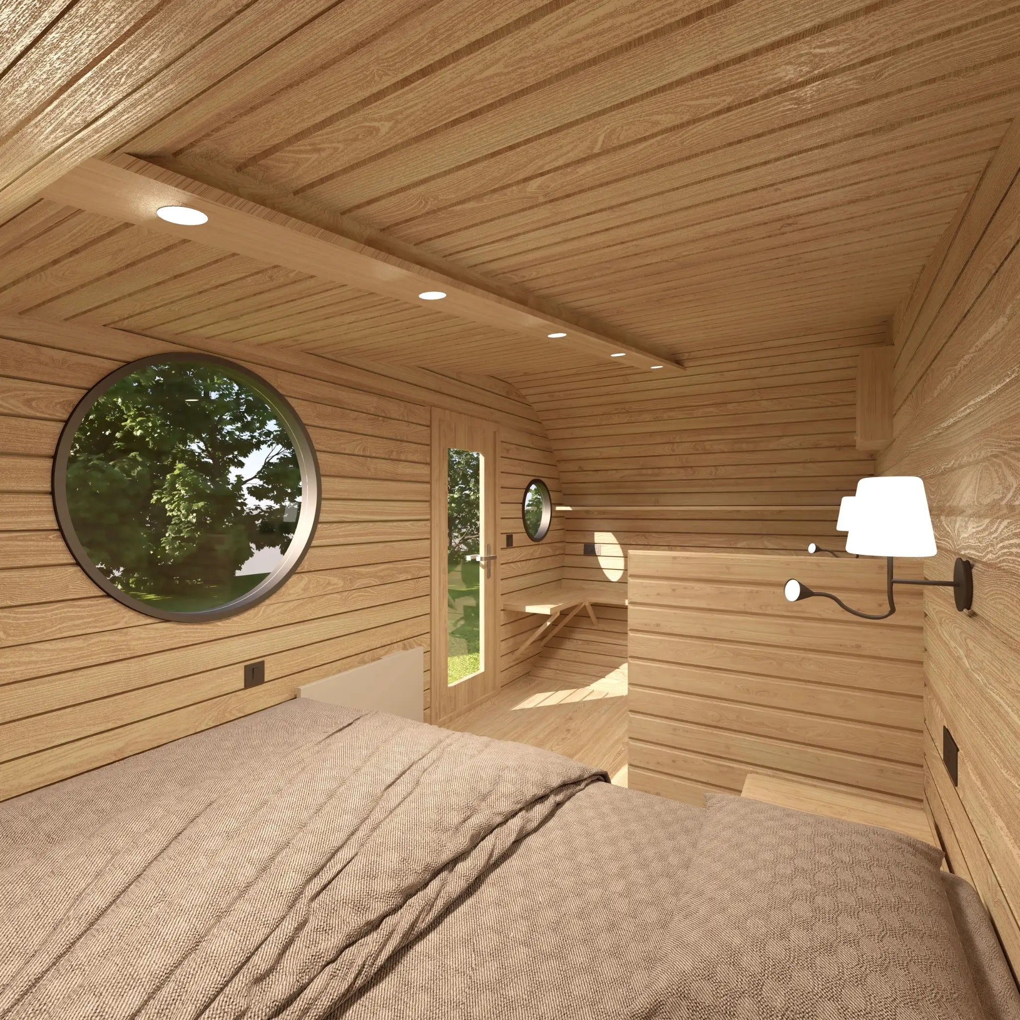 Double bed area in The Grotto Pod luxury 3 person glamping pod facing the entrance and circular window.